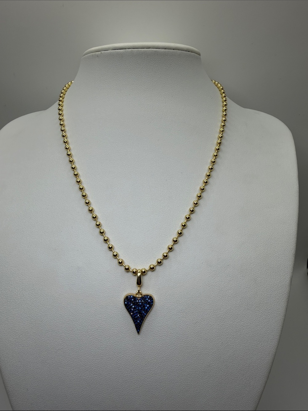 024. 18k Gold Plated Ball Chain with Navy Crystal Heart Pendant. 18”